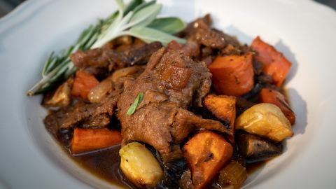 A meal of roasted vegetables and seitan, a plant-based meat substitute, is one of the recipes in Buettner's new cookbook.