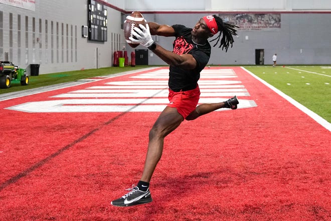 Jul 21, 2023; Columbus, Ohio, USA;  Ohio State Buckeyes wide receiver Marvin Harrison Jr. catches balls from a robotic throwing machine during a summer workout at the Woody Hayes Athletic Center prior to the start of fall camp.