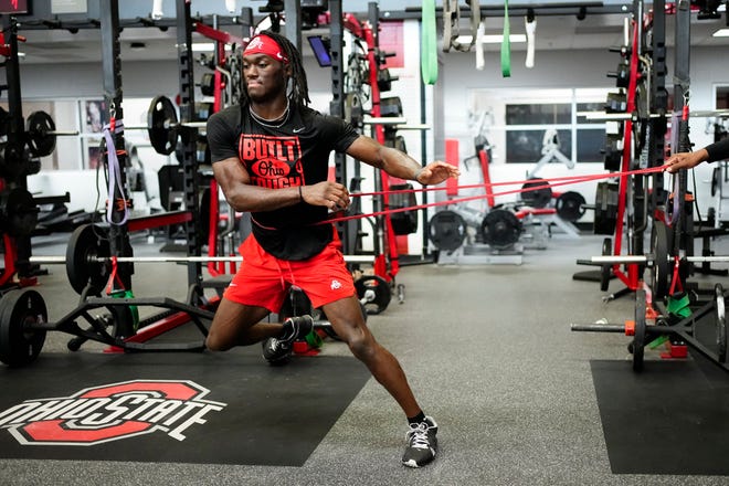 Jul 21, 2023; Columbus, Ohio, USA;  Ohio State Buckeyes wide receiver Marvin Harrison Jr. works out with resistance bands at the Woody Hayes Athletic Center prior to the start of fall camp.