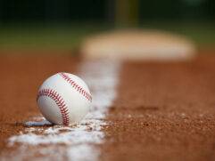 Baseball on the Infield Chalk Line with the Base in the distance