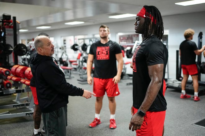 Jul 21, 2023; Columbus, Ohio, USA;  Ohio State Buckeyes wide receiver Marvin Harrison Jr. talks to Mickey Marotti, the assistant athletic director for football sports performance, during his summer workout at the Woody Hayes Athletic Center prior to the start of fall camp.