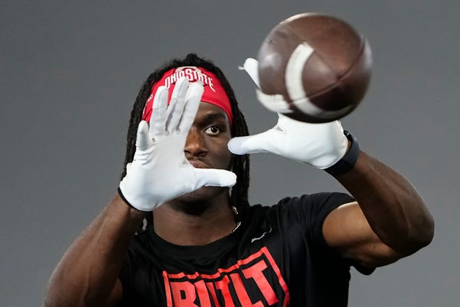Jul 21, 2023; Columbus, Ohio, USA;  Ohio State Buckeyes wide receiver Marvin Harrison Jr. catches balls from a robotic throwing machine during a summer workout at the Woody Hayes Athletic Center prior to the start of fall camp.