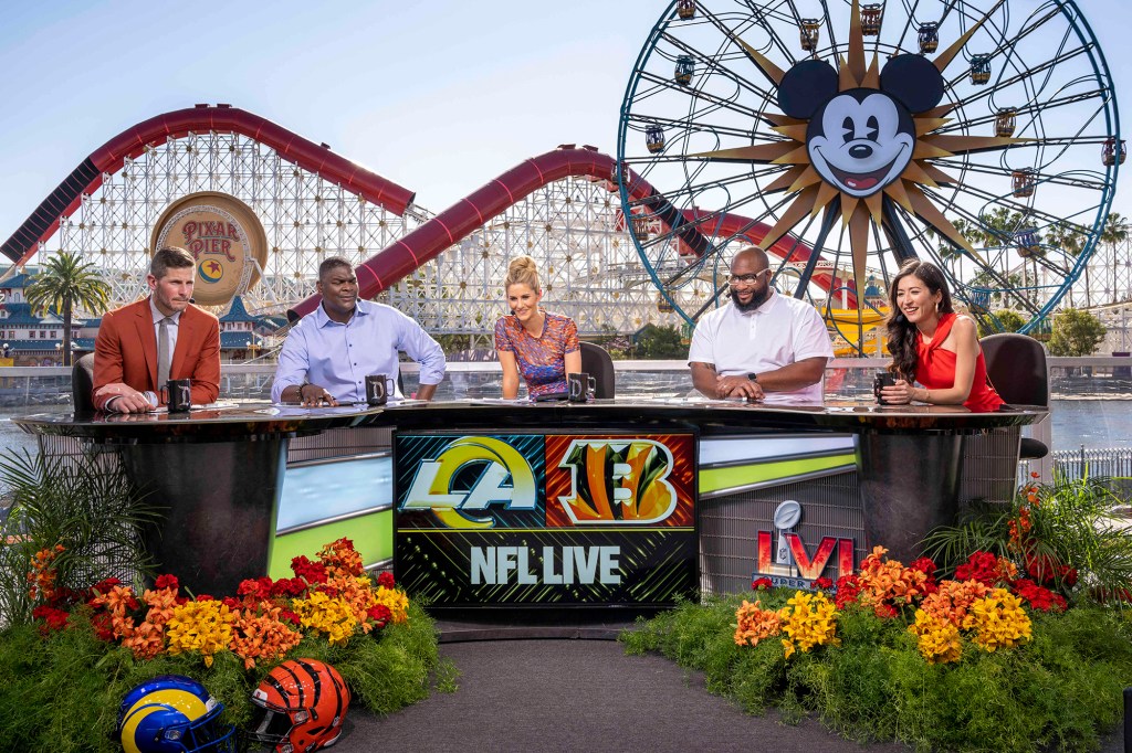 Dan Orlovsky (l.) with the "NFL Live" crew at Disney California Adventure ahead of the Super Bowl on Feb. 10, 2022.