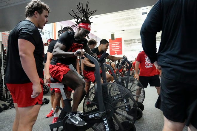 Jul 21, 2023; Columbus, Ohio, USA;  Ohio State Buckeyes wide receiver Marvin Harrison Jr. rides a bike during a summer workout at the Woody Hayes Athletic Center prior to the start of fall camp.