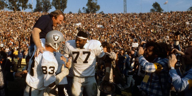 Coach John Madden gets carried off the field by his Oakland Raiders players after they defeated the Minnesota Vikings in Super Bowl XI on Jan. 9, 1977, at the Rose Bowl in Pasadena, California. 